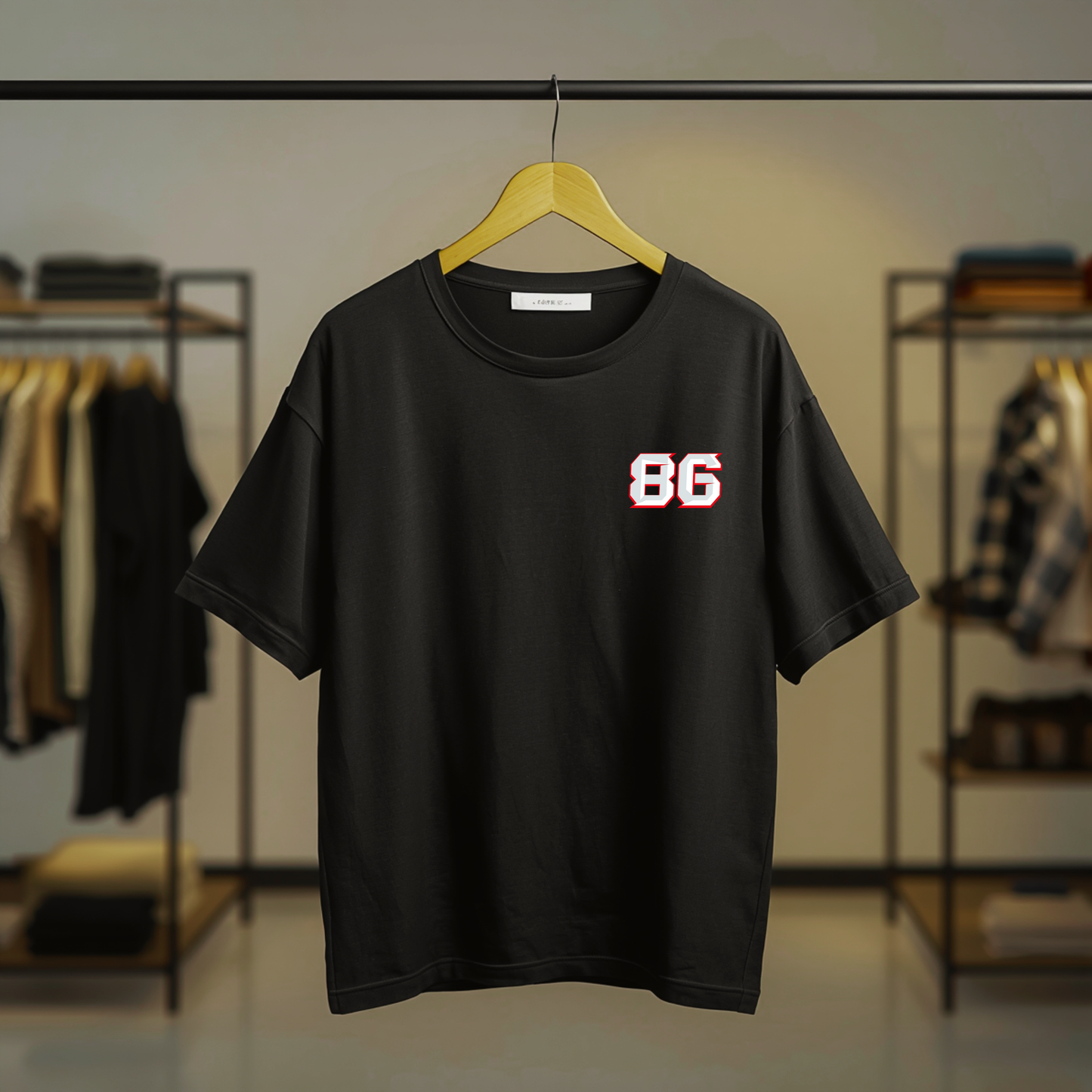 Black MotoGP motorcycle racing graphic T-shirt with racing numbers and motorcycle-inspired artwork on the front