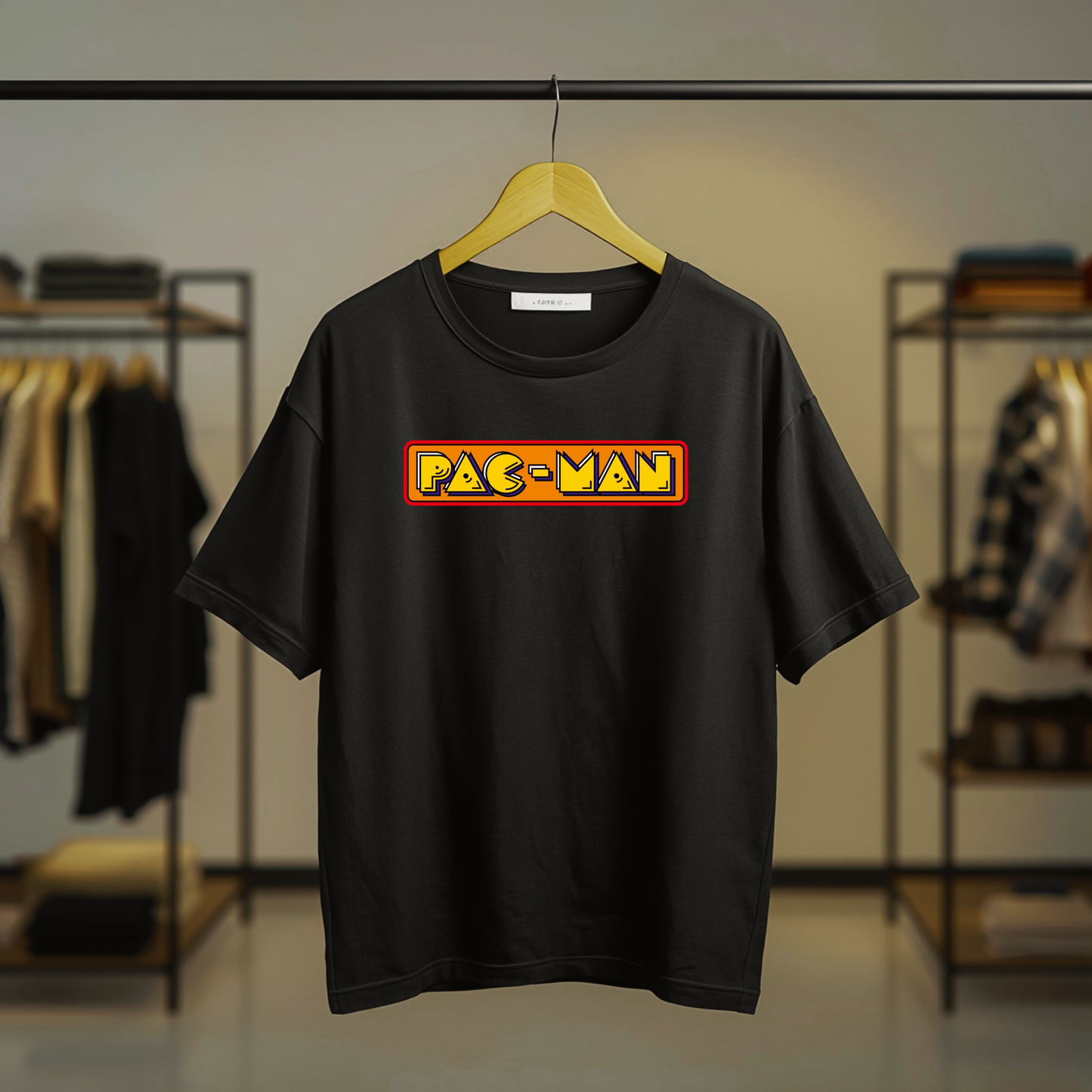 Pac-Man inspired colorful retro arcade graphic on the front of a black T-shirt