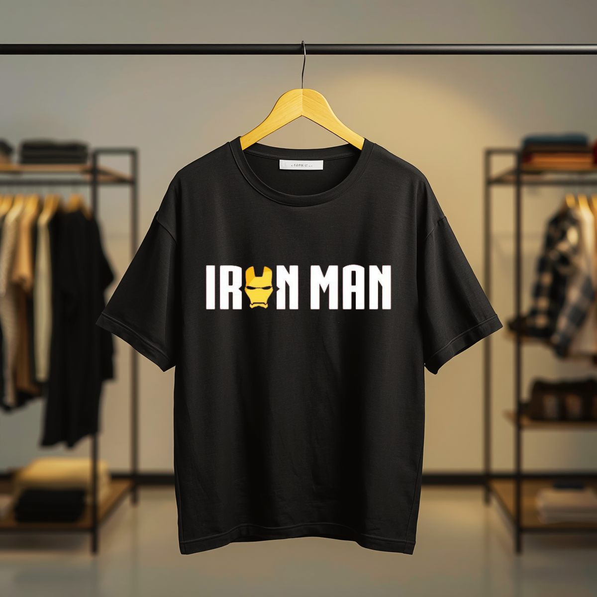 Black T-Shirt featuring Iron Man logo typography with gold helmet graphic on the front print.
